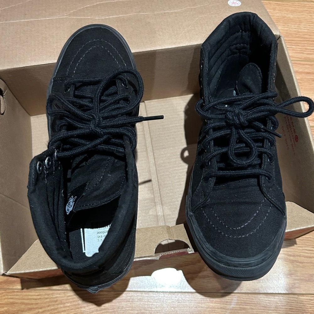 Vans  black shoe high top shoes, size 7.5 women, 6 men. Worn in house once.
